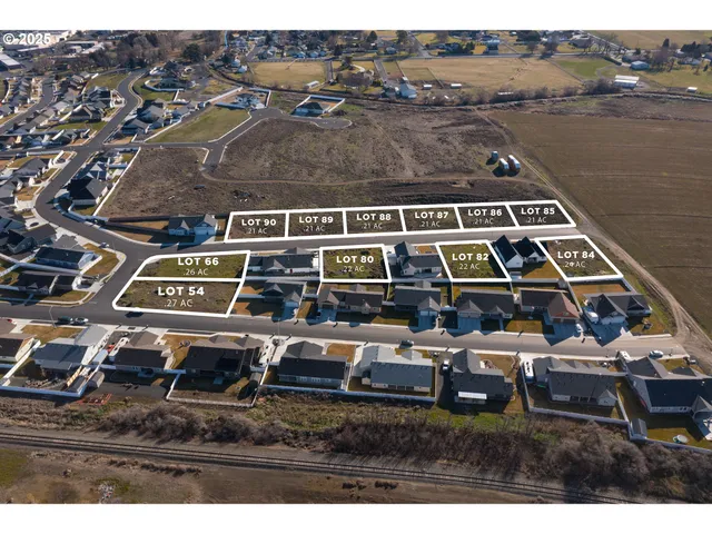 an aerial view of a house with lake view