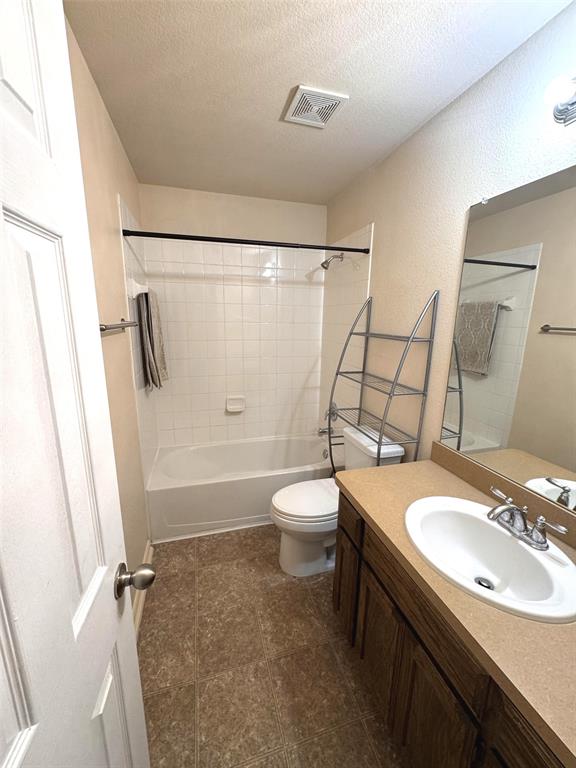 2831 Painted Trail Dallas, TX 75237 - Photo 14 of 14 a bathroom with a sink toilet and shower