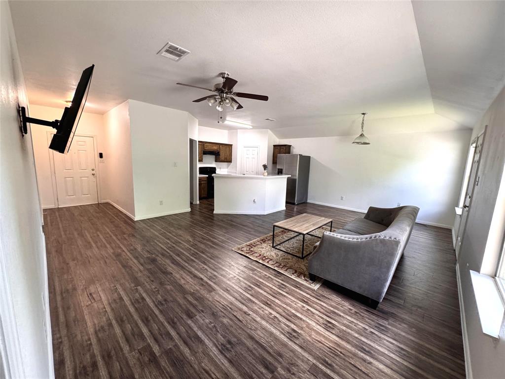 2831 Painted Trail Dallas, TX 75237 - Photo 2 of 14 a living room with furniture and a wooden floor