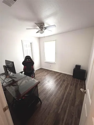 a workspace with furniture and wooden floor