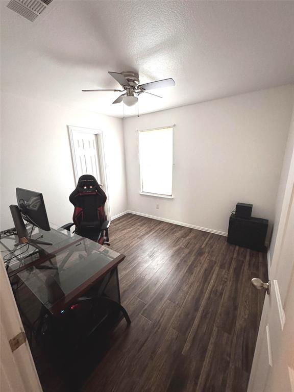 2831 Painted Trail Dallas, TX 75237 - Photo 6 of 14 a workspace with furniture and wooden floor