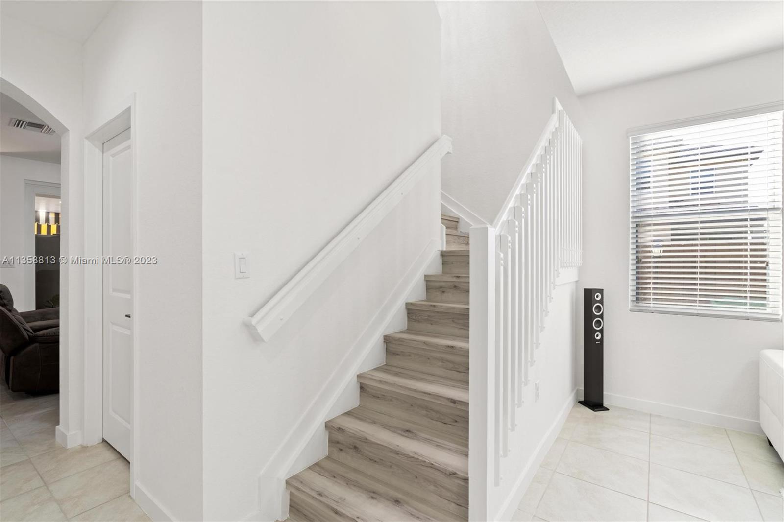 11744 Southwest 244 Street Homestead, FL 33032 - Photo 16 of 32 a view of entryway and hall with wooden floor