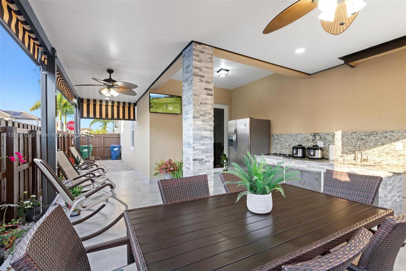 11744 Southwest 244 Street Homestead, FL 33032 - Photo 29 of 32 a dining room with furniture and wooden floor