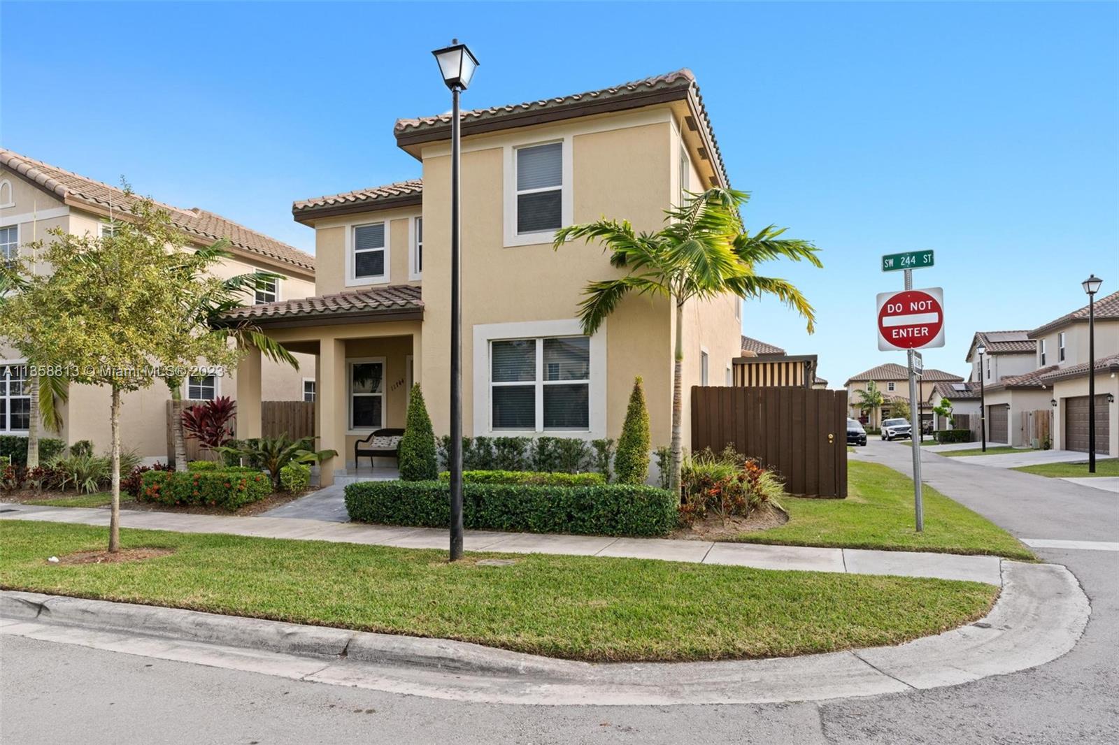 11744 Southwest 244 Street Homestead, FL 33032 - Photo 3 of 32 a view of a house with a swimming pool and a yard