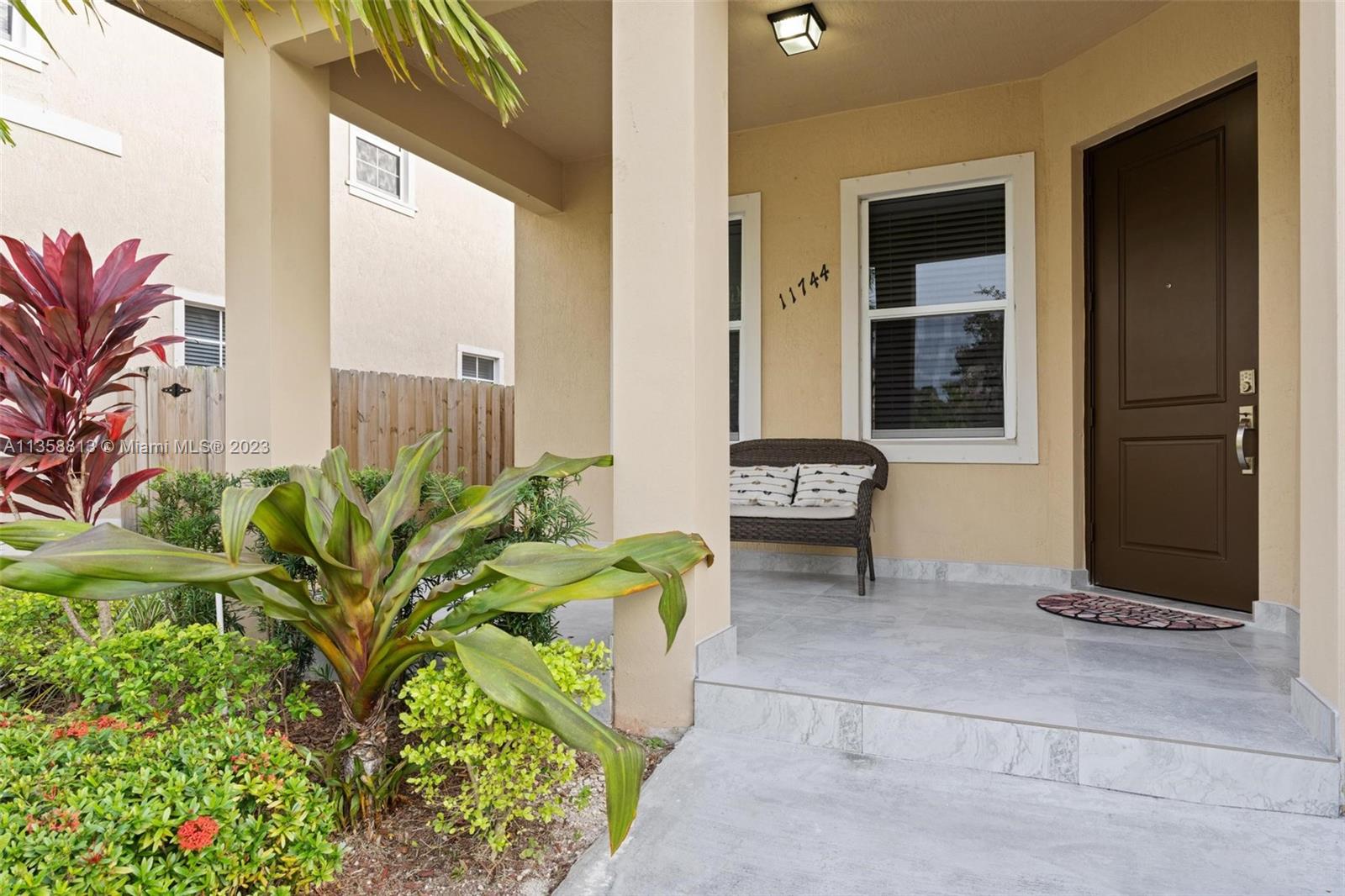 11744 Southwest 244 Street Homestead, FL 33032 - Photo 4 of 32 a living room with a rug and a potted plant
