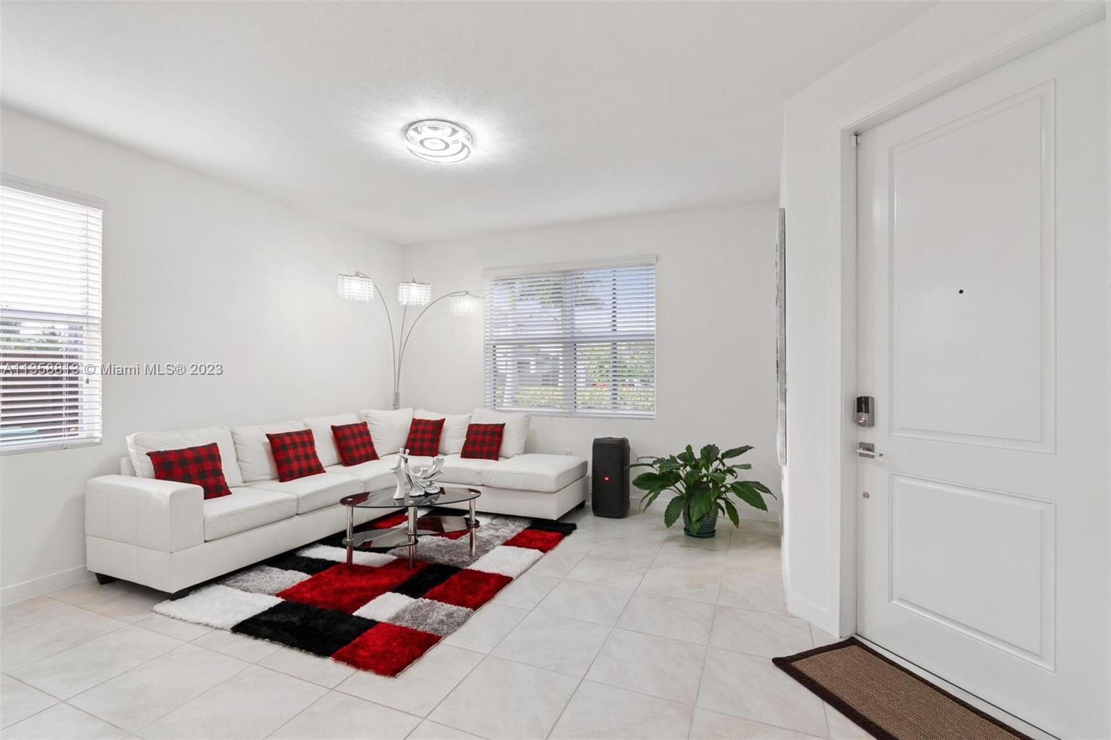 11744 Southwest 244 Street Homestead, FL 33032 - Photo 6 of 32 a living room with furniture and a potted plant