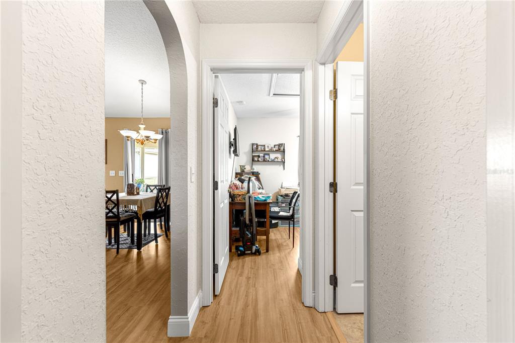 12459 Southeast 176th Loop Summerfield, FL 34491 - Photo 3 of 34 a view of a living room with furniture and wooden floor