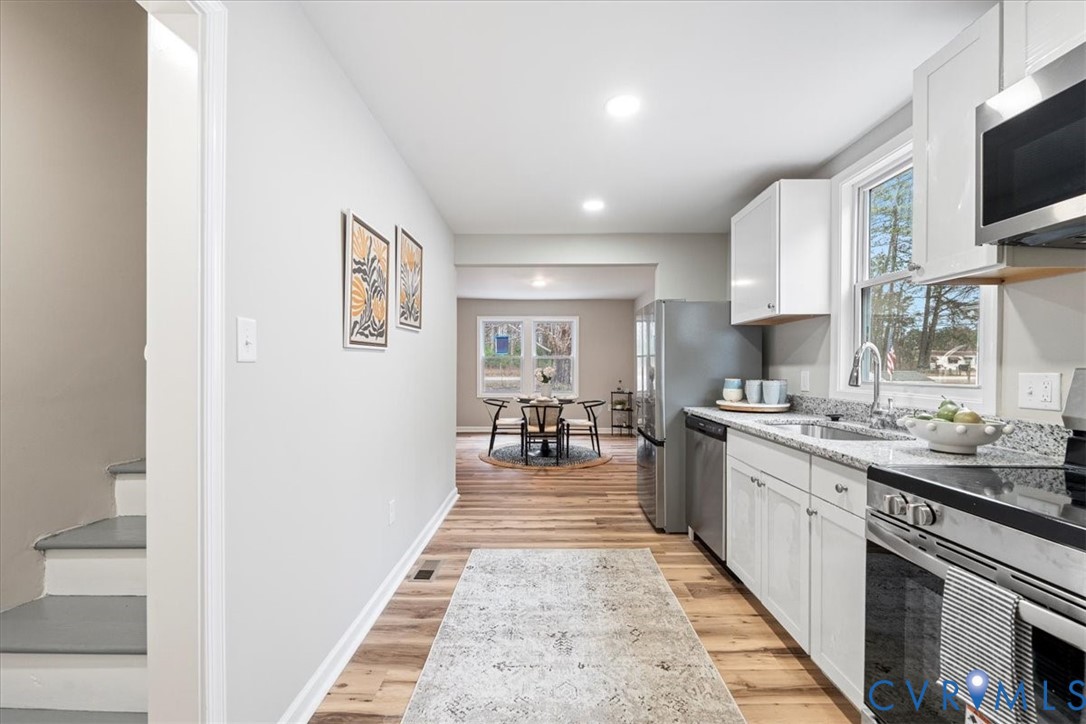 1989 Cox Road Blackstone, VA 23824 - Photo 13 of 44 a kitchen with sink stove and cabinets