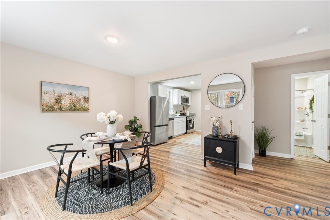1989 Cox Road Blackstone, VA 23824 - Photo 15 of 44 a living room with fireplace furniture and a wooden floor