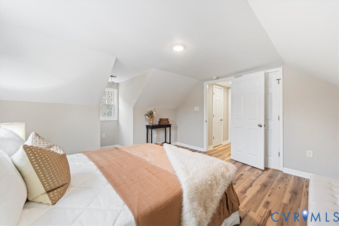 1989 Cox Road Blackstone, VA 23824 - Photo 16 of 44 a bed room with a bed and a chair