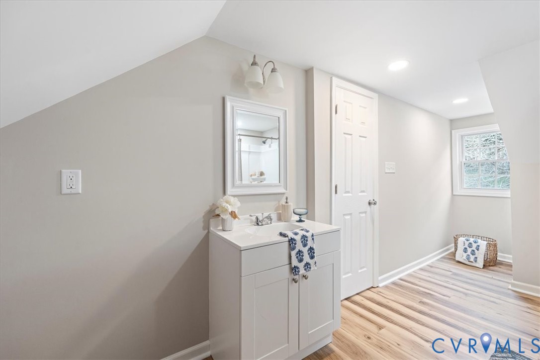 1989 Cox Road Blackstone, VA 23824 - Photo 19 of 44 a bathroom with a sink a mirror and vanity