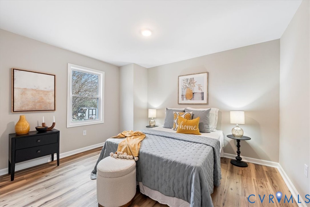 1989 Cox Road Blackstone, VA 23824 - Photo 21 of 44 a bedroom with a bed and wooden floor