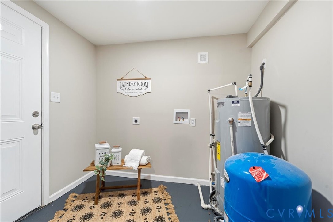1989 Cox Road Blackstone, VA 23824 - Photo 27 of 44 a bedroom with furniture and a wooden floor