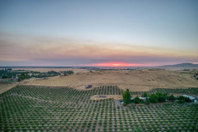 a view of a chairs and tables in a small room