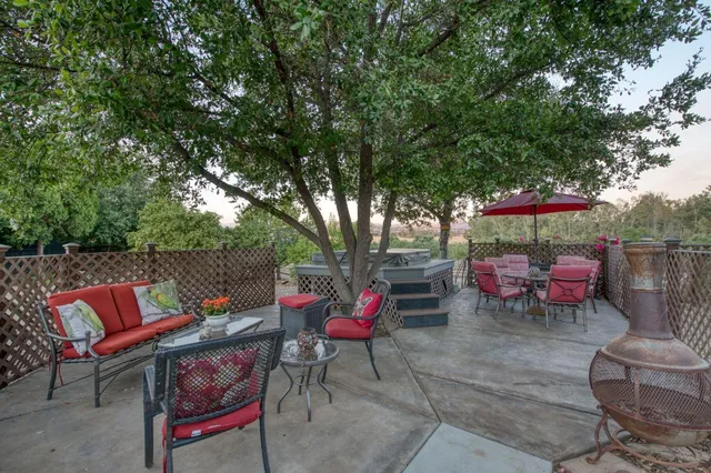 a kitchen with granite countertop a sink stainless steel appliances and cabinets