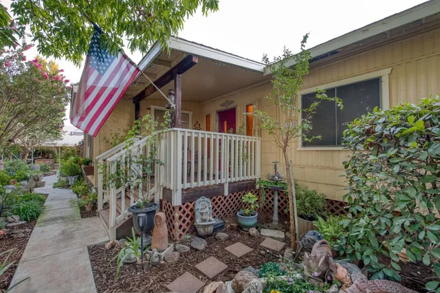 a view of a house with balcony and garden