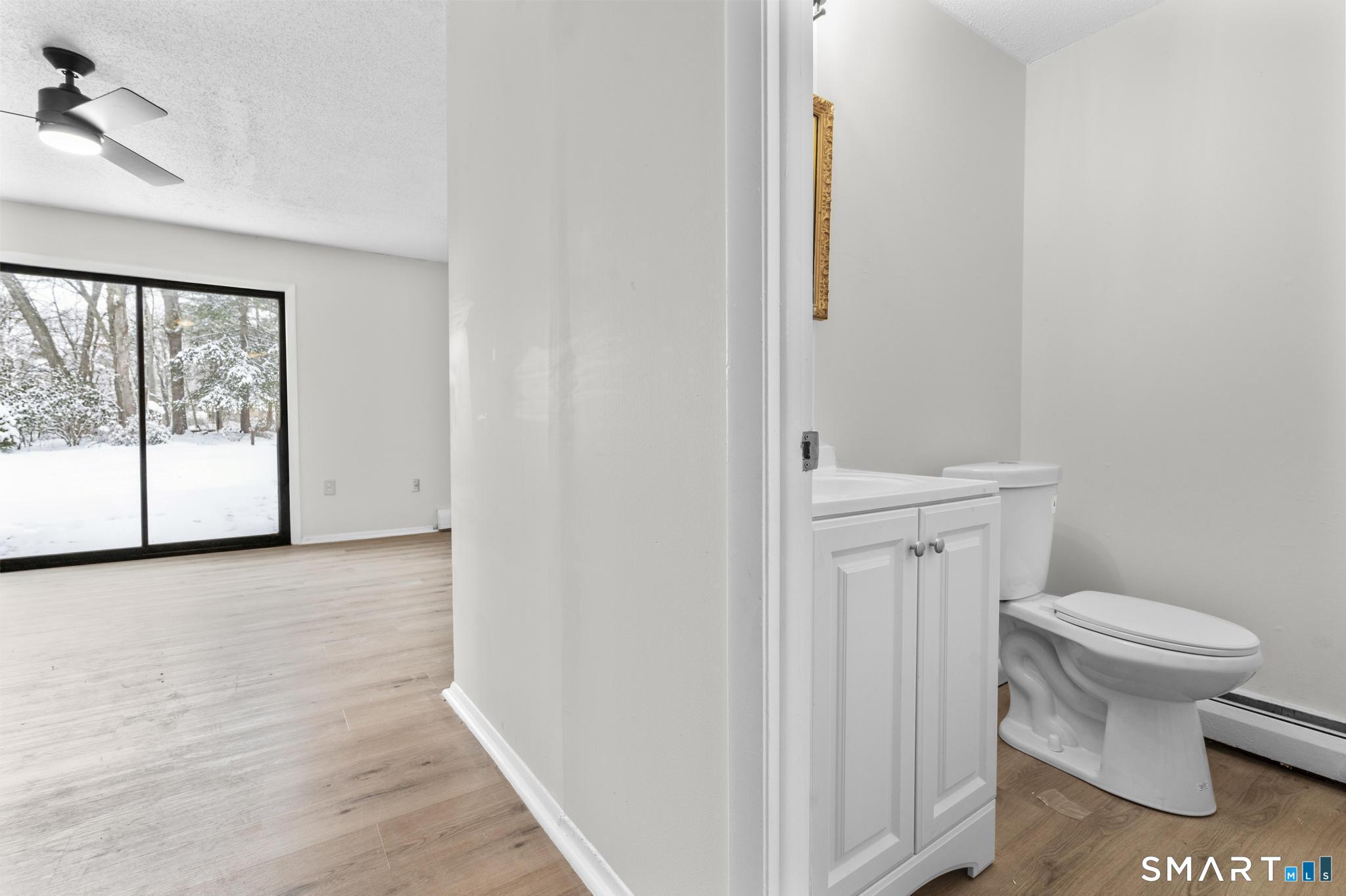 83 Sutton Place, Unit 83 Bloomfield, CT 06002 - Photo 13 of 29 a bathroom with a toilet and a sink