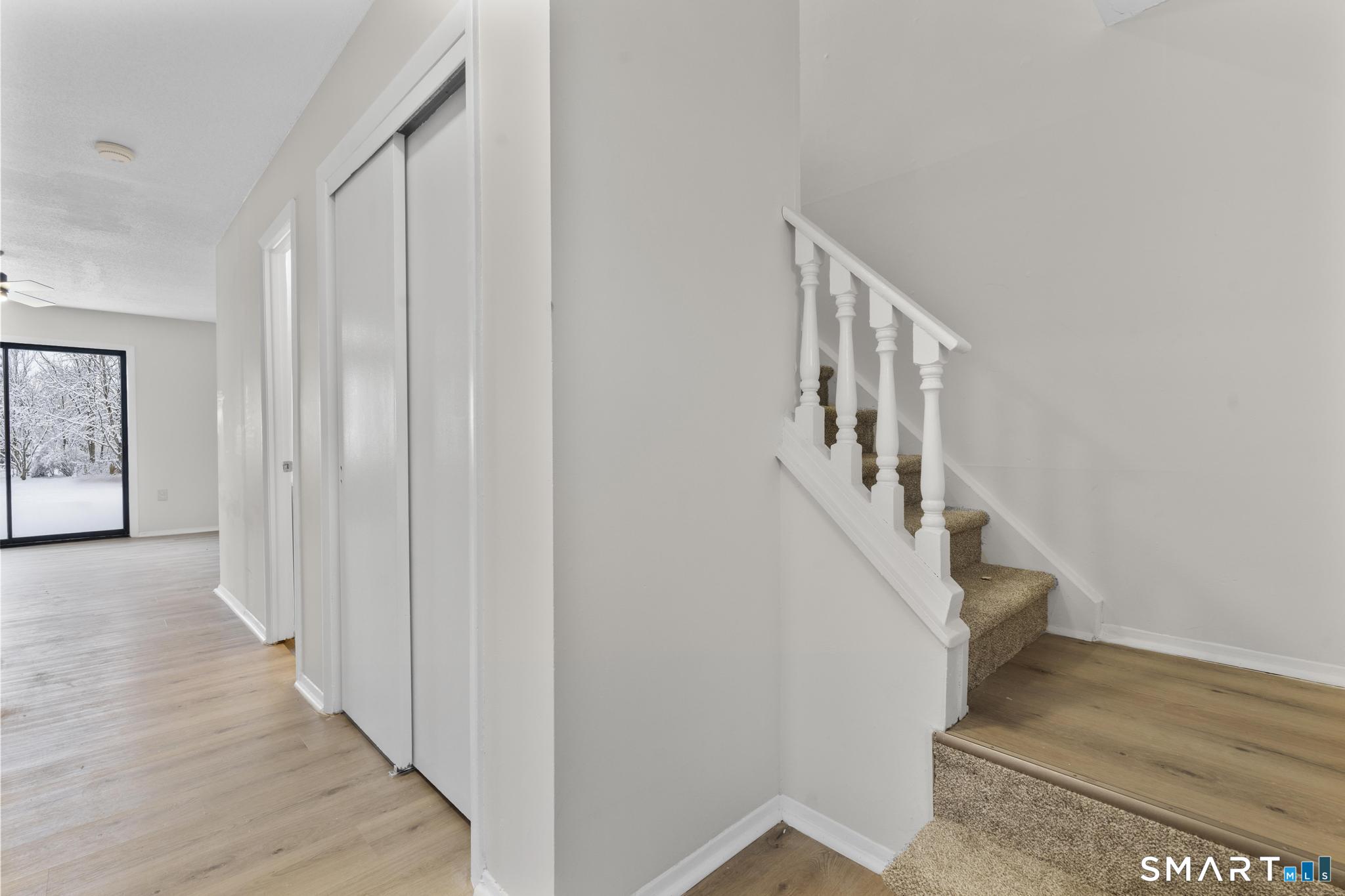 83 Sutton Place, Unit 83 Bloomfield, CT 06002 - Photo 8 of 29 a view of a hallway with staircase