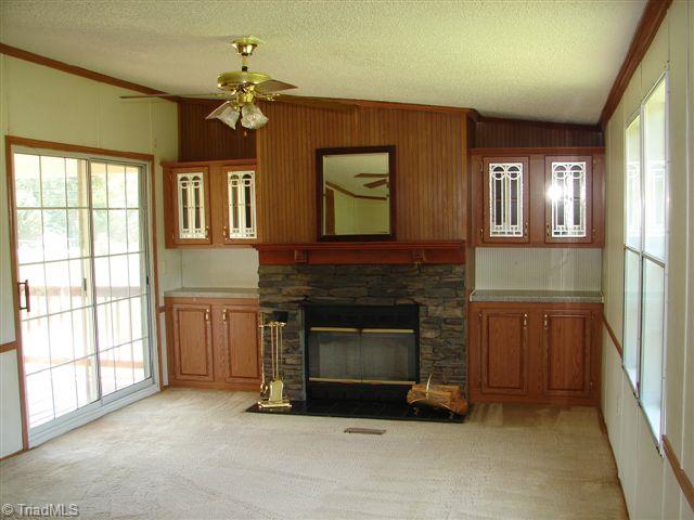 958 Langley Road Staley, NC 27355 - Photo 16 of 30 Den with Rock Profile fireplace.