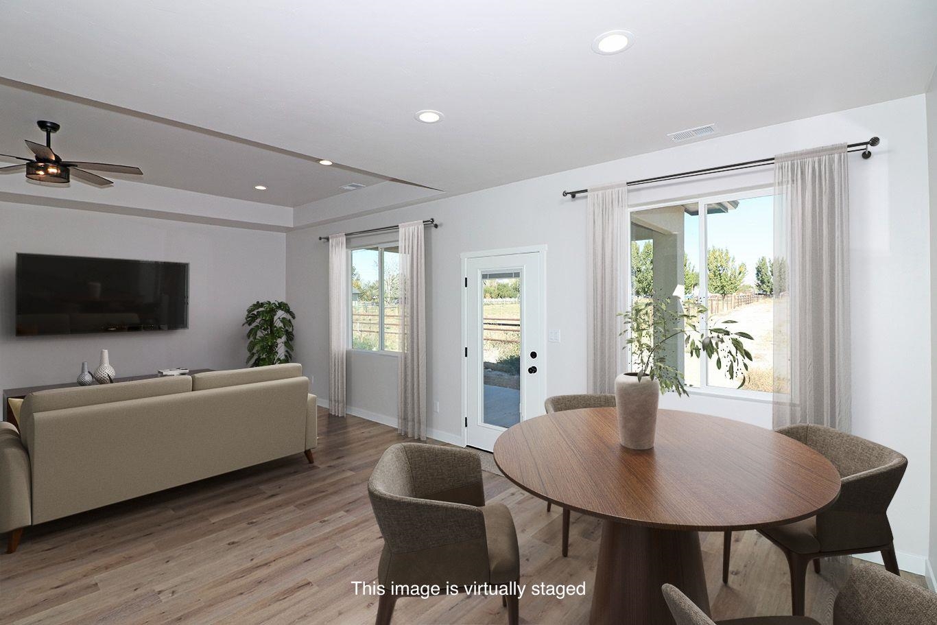 2954 Apollo Drive Grand Junction, CO 81504 - Photo 12 of 40 a living room with furniture and a flat screen tv