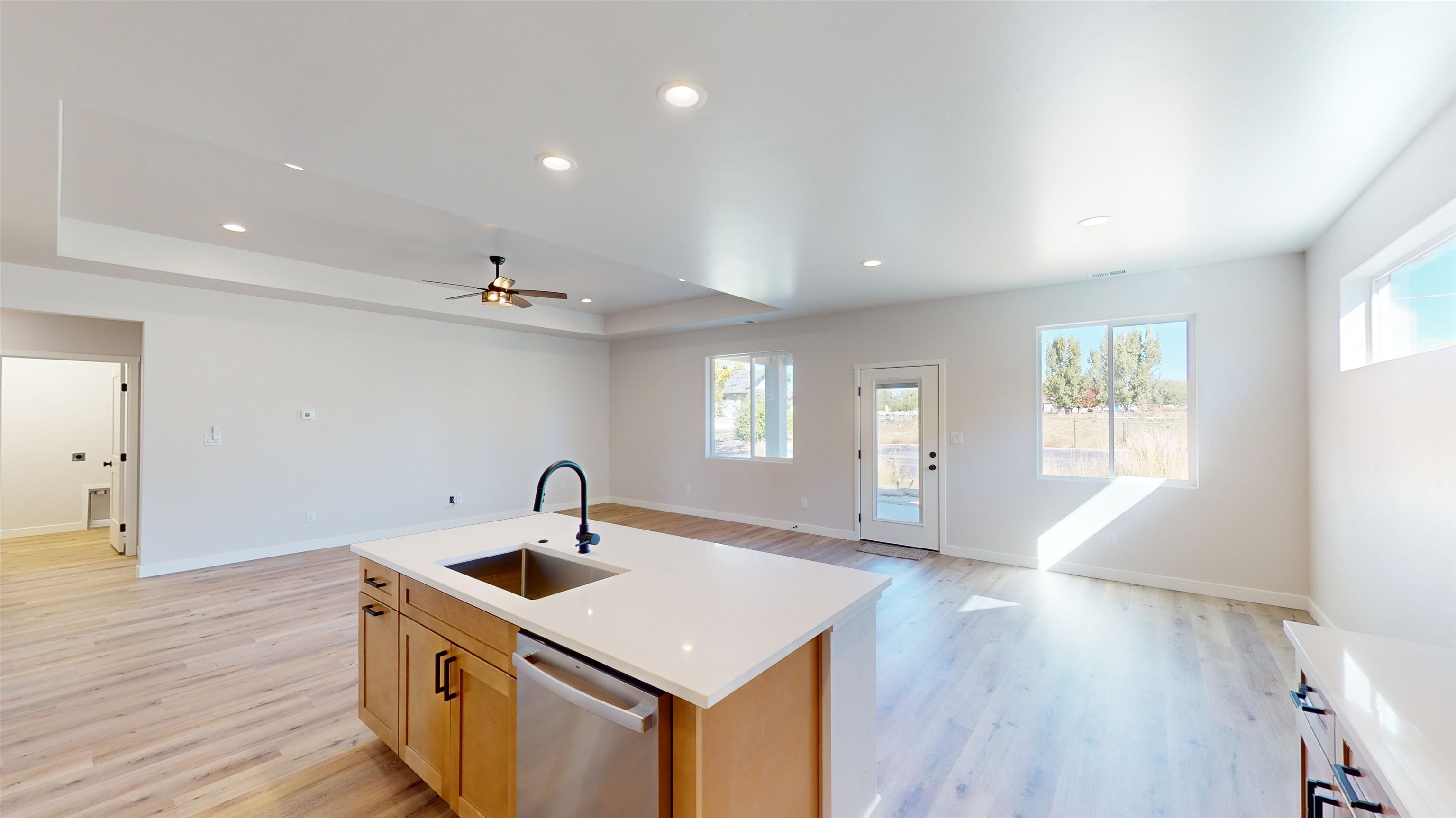 2954 Apollo Drive Grand Junction, CO 81504 - Photo 13 of 40 a kitchen that has a sink a window and wooden floor