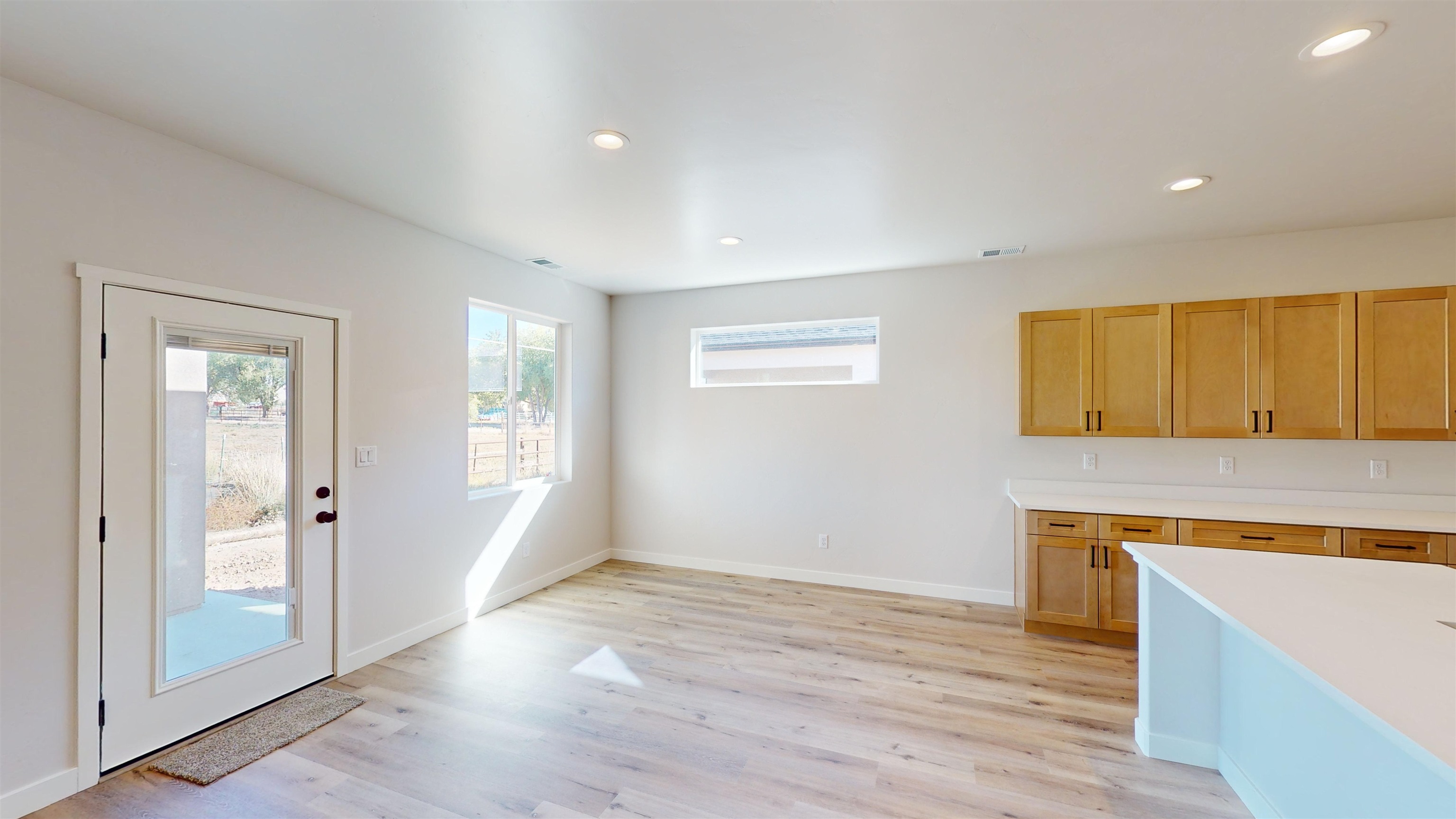 2954 Apollo Drive Grand Junction, CO 81504 - Photo 17 of 40 wooden floor in an empty room with a window