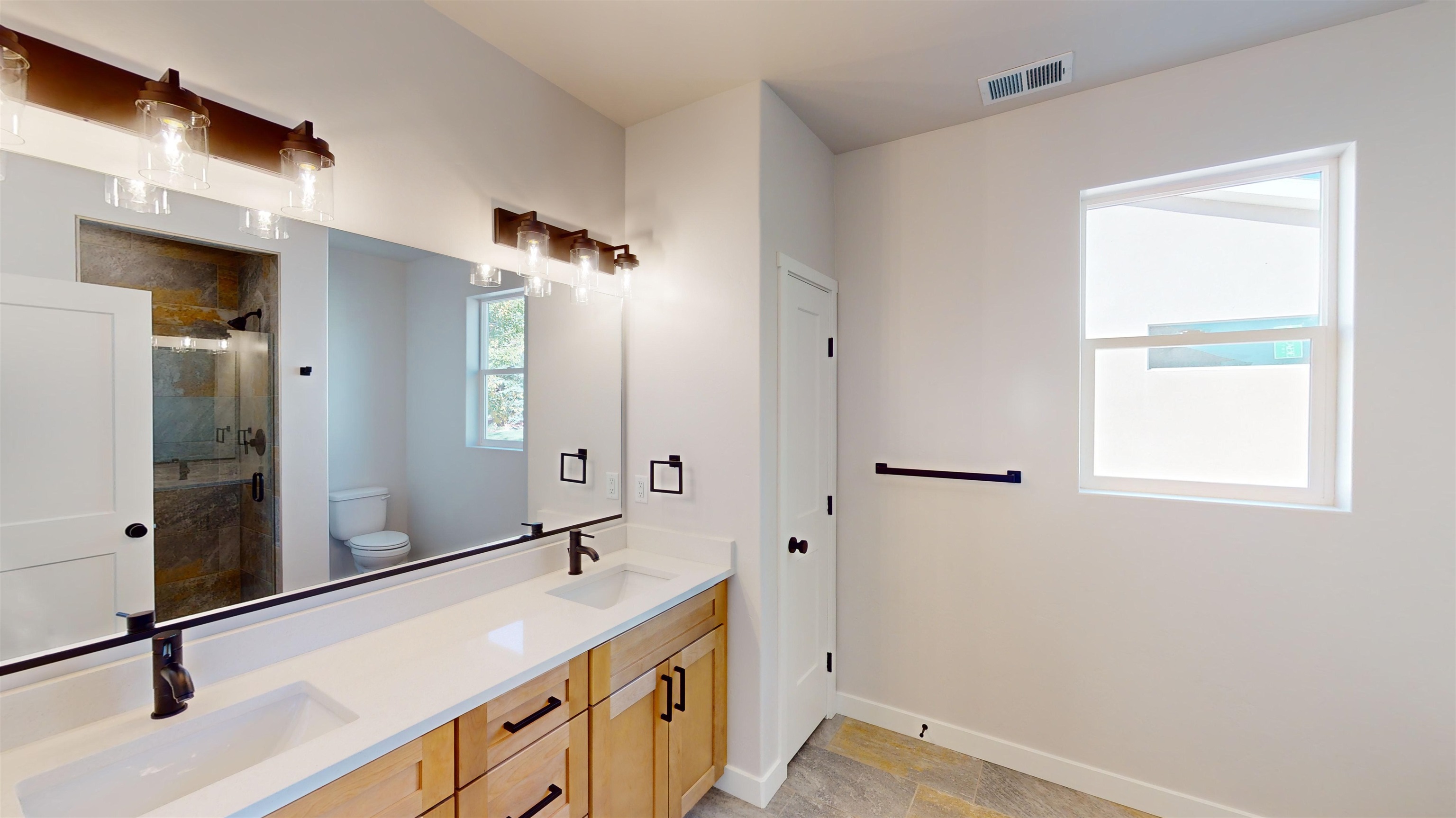 2954 Apollo Drive Grand Junction, CO 81504 - Photo 27 of 40 a bathroom with a sink and a mirror
