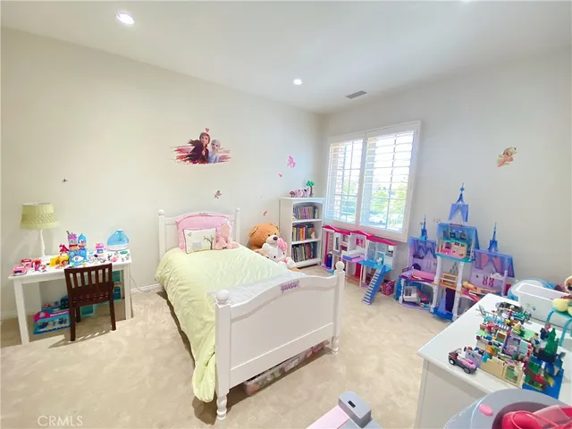 a bedroom with furniture a bed and a window