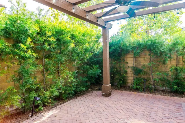 a view of backyard with plants and lake view