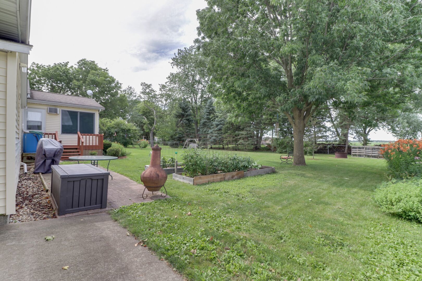 509 Division Road Wapella, IL 61777 - Photo 23 of 27 a view of a garden with patio