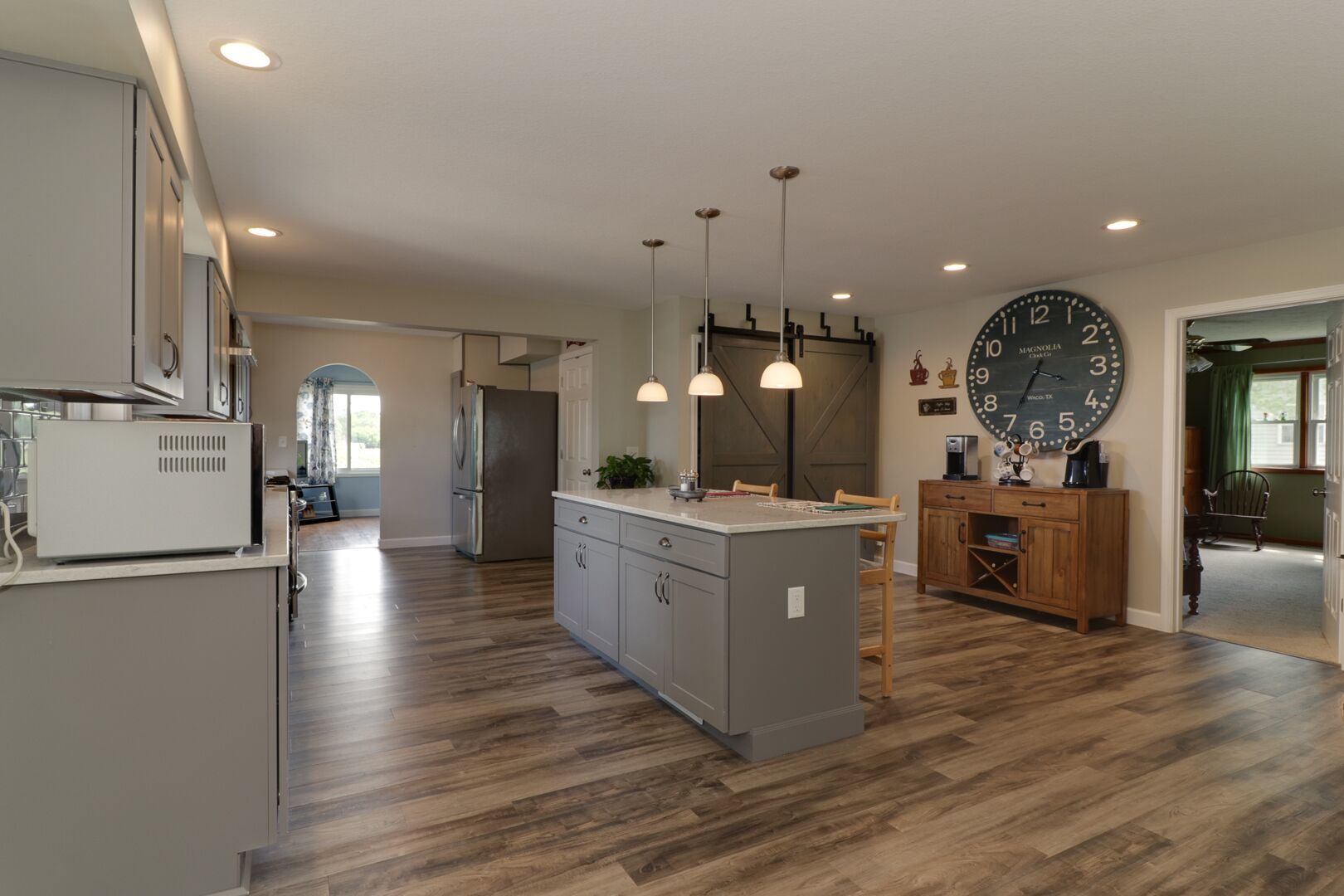 509 Division Road Wapella, IL 61777 - Photo 7 of 27 a view of a living room kitchen and a wooden floor