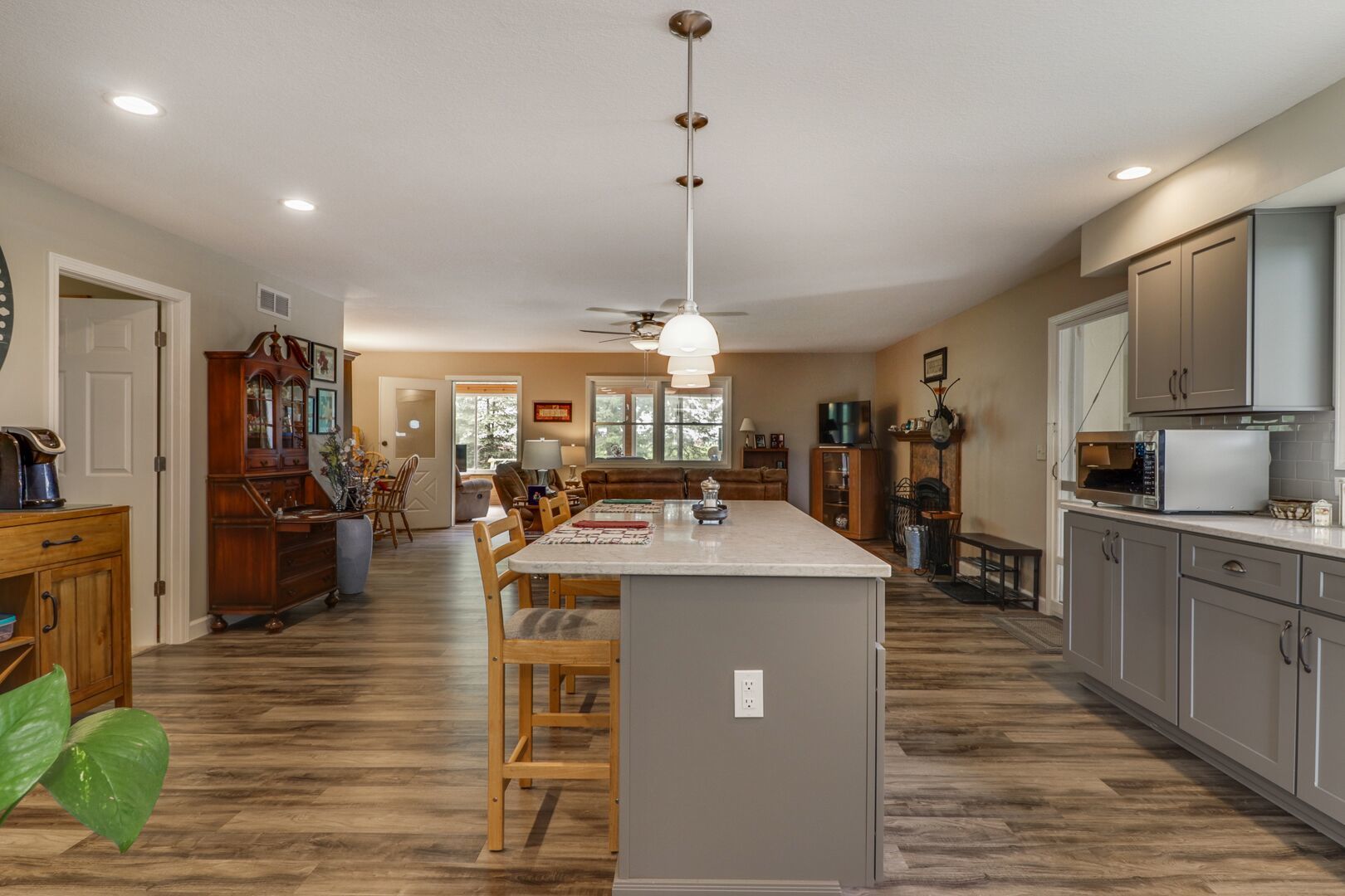 509 Division Road Wapella, IL 61777 - Photo 8 of 27 a view of a kitchen with kitchen island a counter top space a sink stainless steel appliances and cabinets