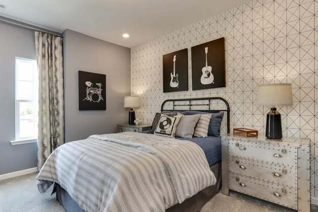 a bedroom with a bed and wall painting