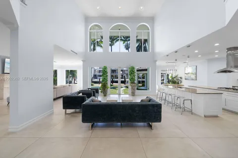 a kitchen with a stove a refrigerator and a sink