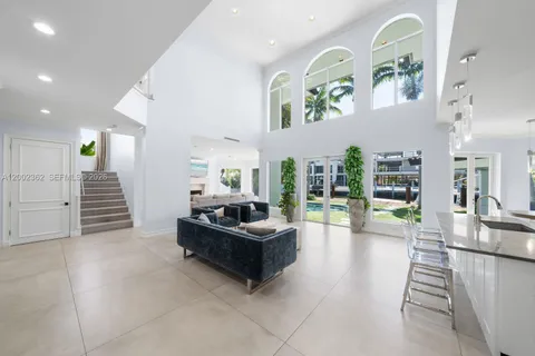 a kitchen with a sink and chandelier