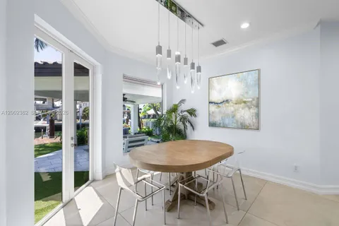 a spacious bedroom with a bed and glass door