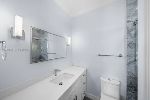 a utility room with a sink washer and dryer