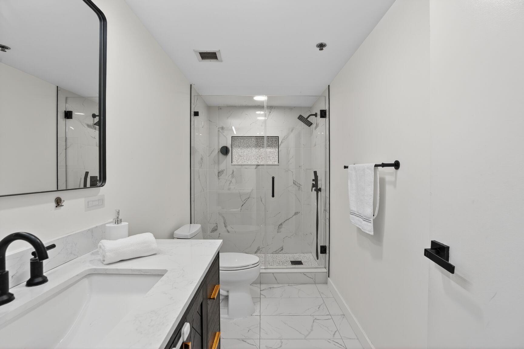 700 1st Street, Unit 7T Hoboken, NJ 07030 - Photo 18 of 25 a bathroom with a sink shower and a mirror