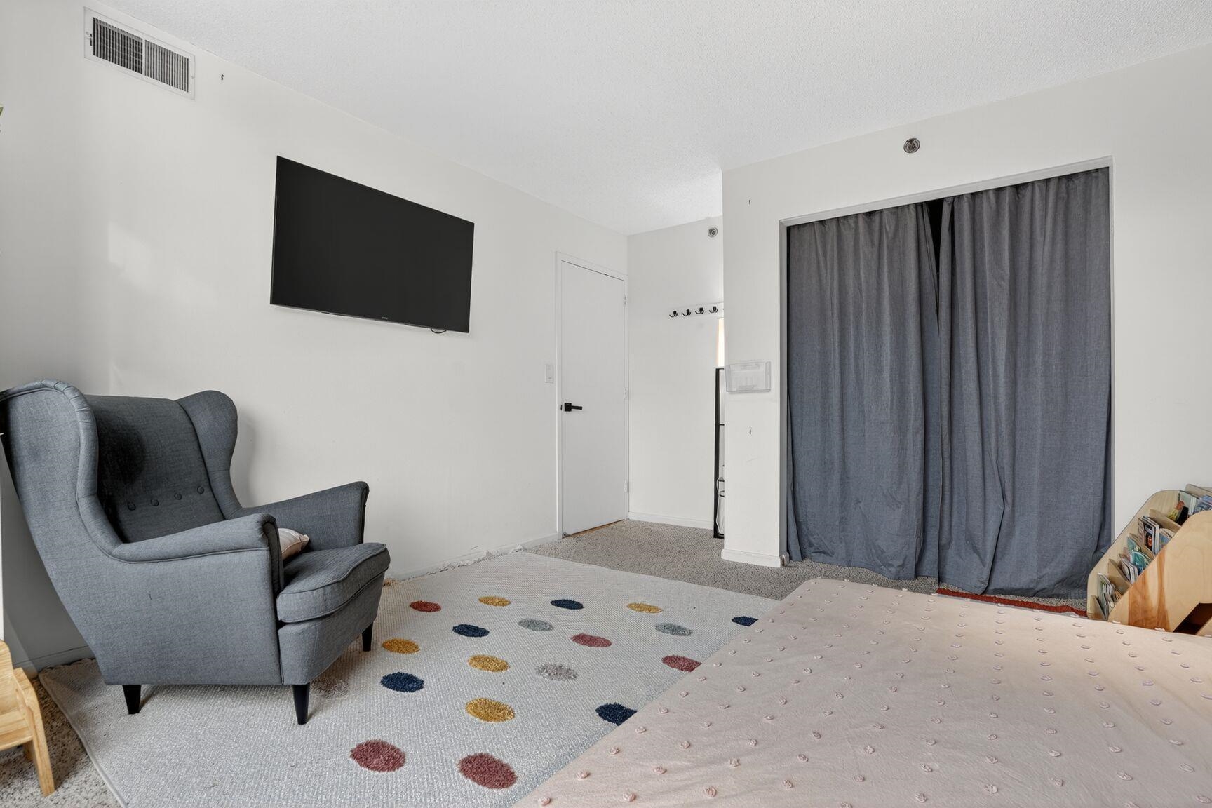 700 1st Street, Unit 7T Hoboken, NJ 07030 - Photo 20 of 25 a bedroom with a bed and flat screen tv