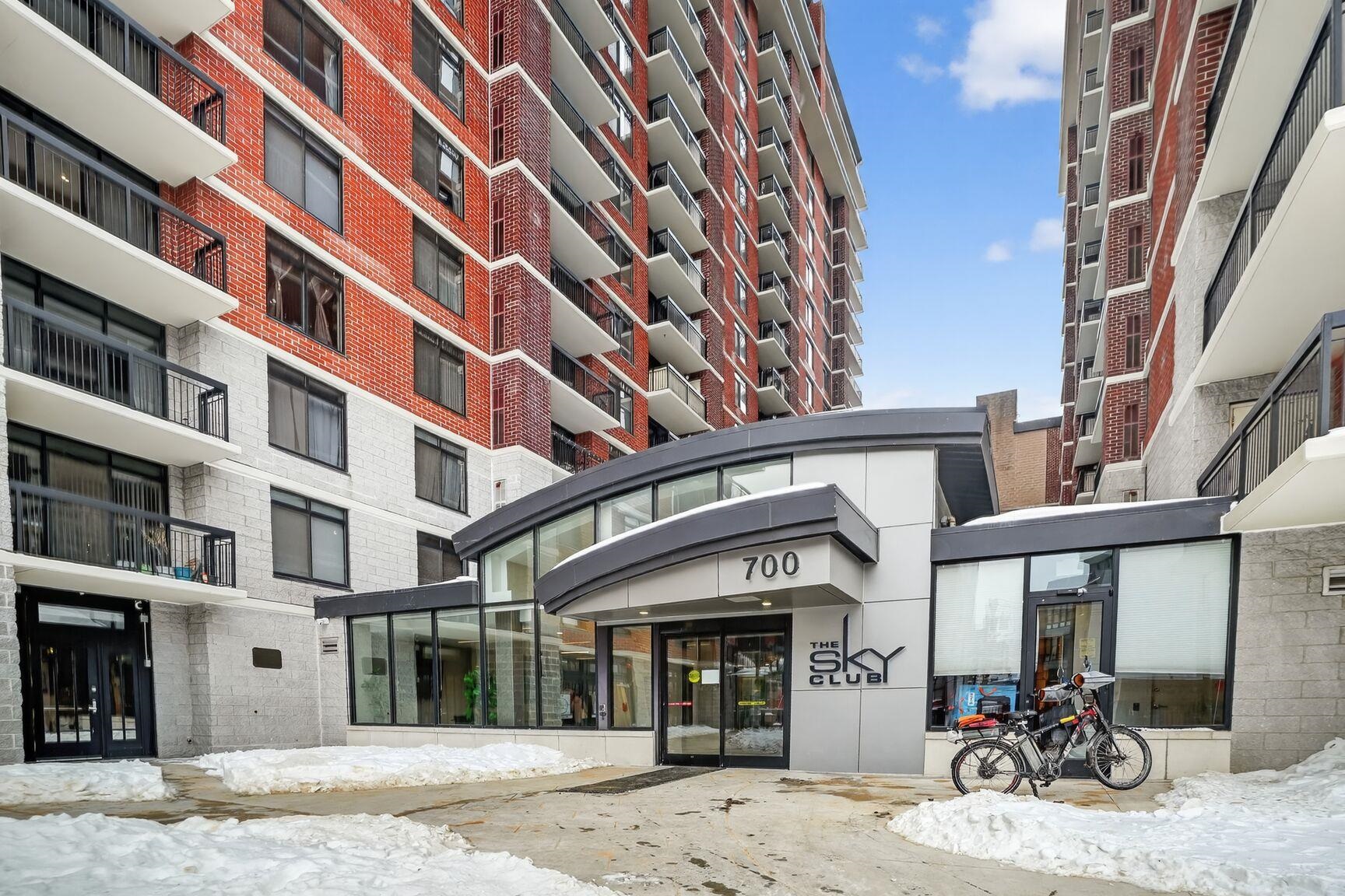 700 1st Street, Unit 7T Hoboken, NJ 07030 - Photo 2 of 25 a view of a building with a lot of windows and chairs