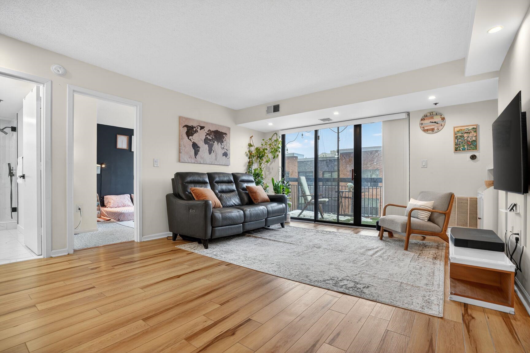 700 1st Street, Unit 7T Hoboken, NJ 07030 - Photo 6 of 25 a living room with furniture and a large window