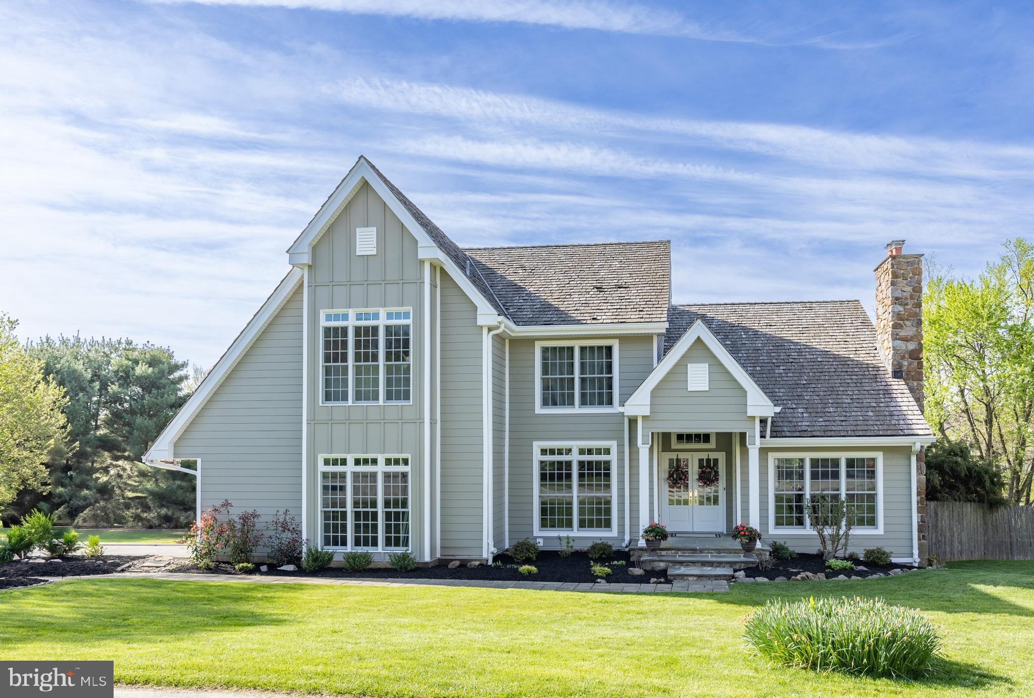 front view of a house with a yard