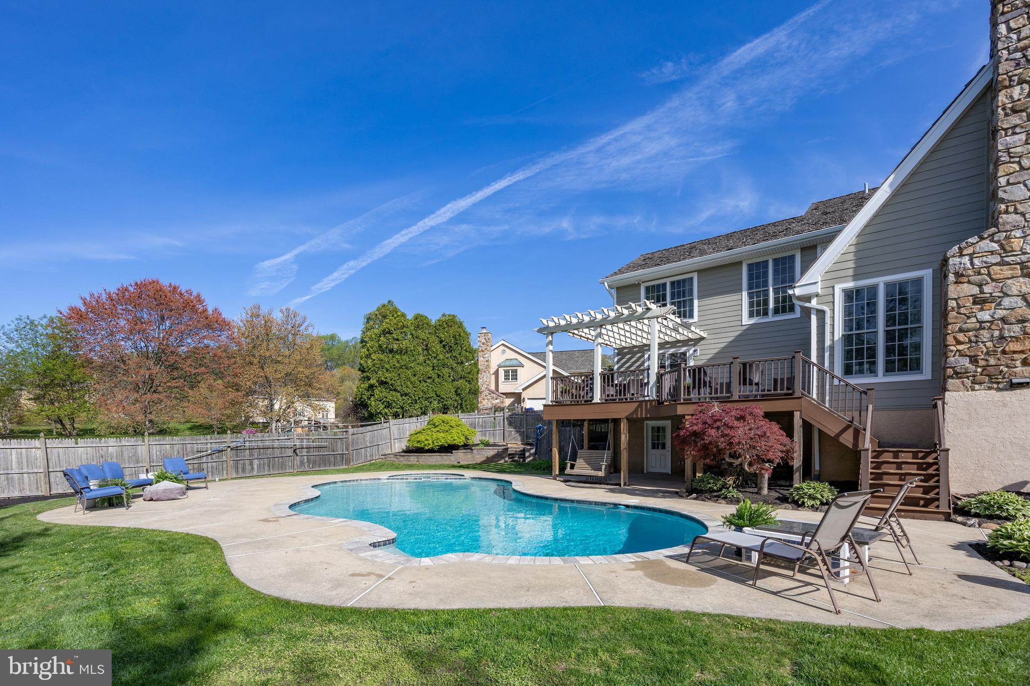 10 Brampton Road Malvern, PA 19355 - Photo 2 of 49 a view of a house with swimming pool and sitting area
