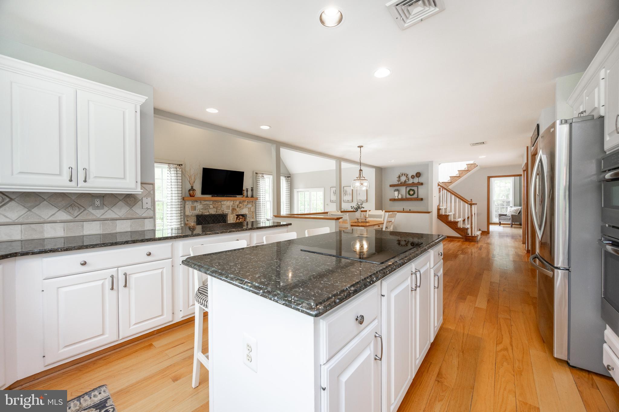 10 Brampton Road Malvern, PA 19355 - Photo 22 of 49 a kitchen with stainless steel appliances granite countertop a sink stove and refrigerator