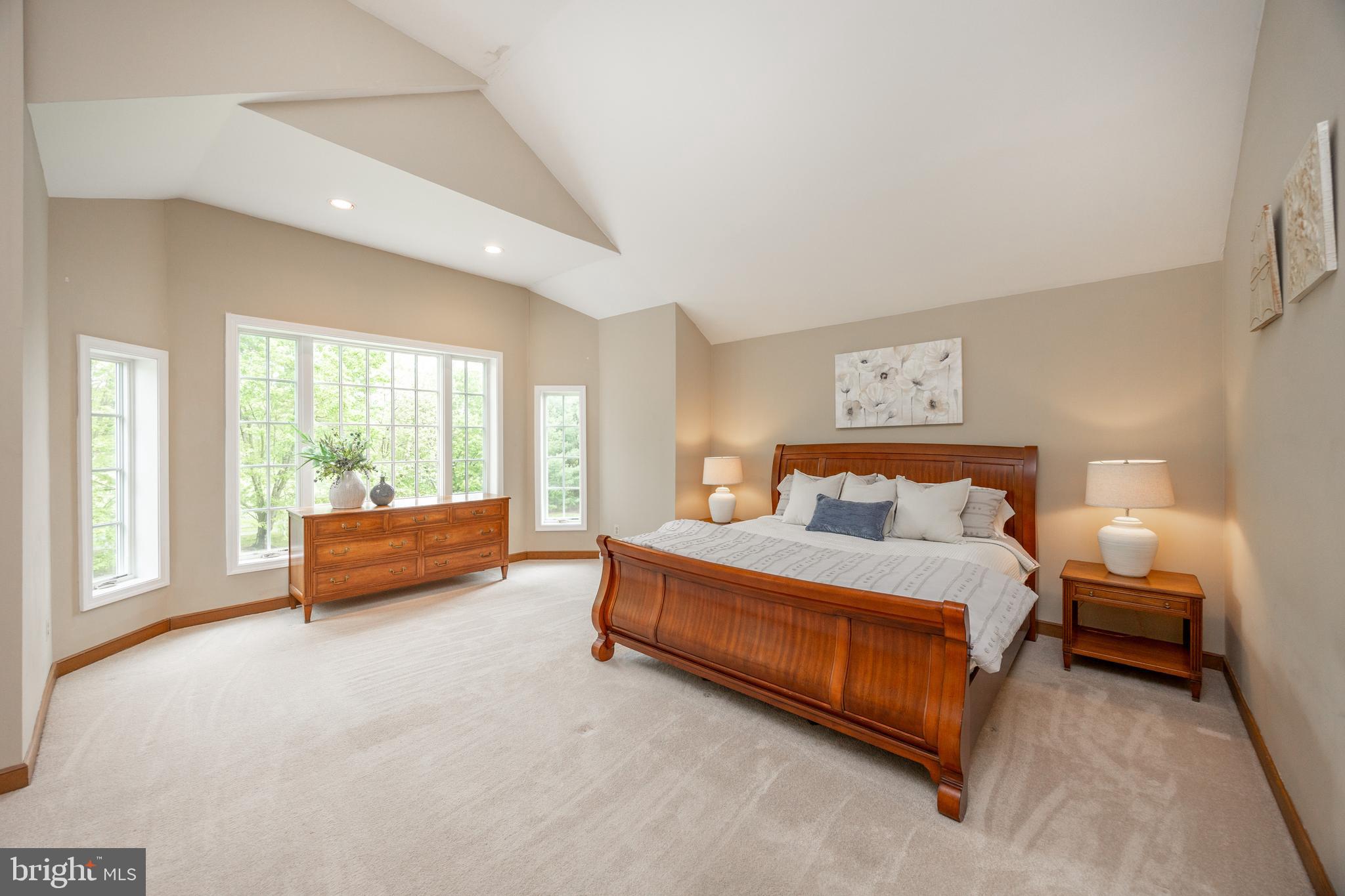 10 Brampton Road Malvern, PA 19355 - Photo 25 of 49 a spacious bedroom with a bed and a couch