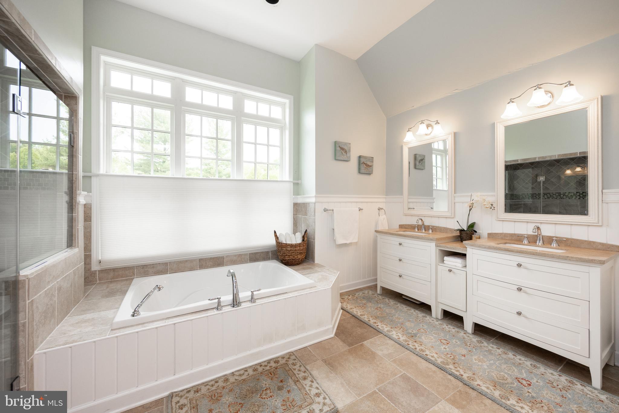 10 Brampton Road Malvern, PA 19355 - Photo 28 of 49 a large white tub sitting in a bathroom next to a window