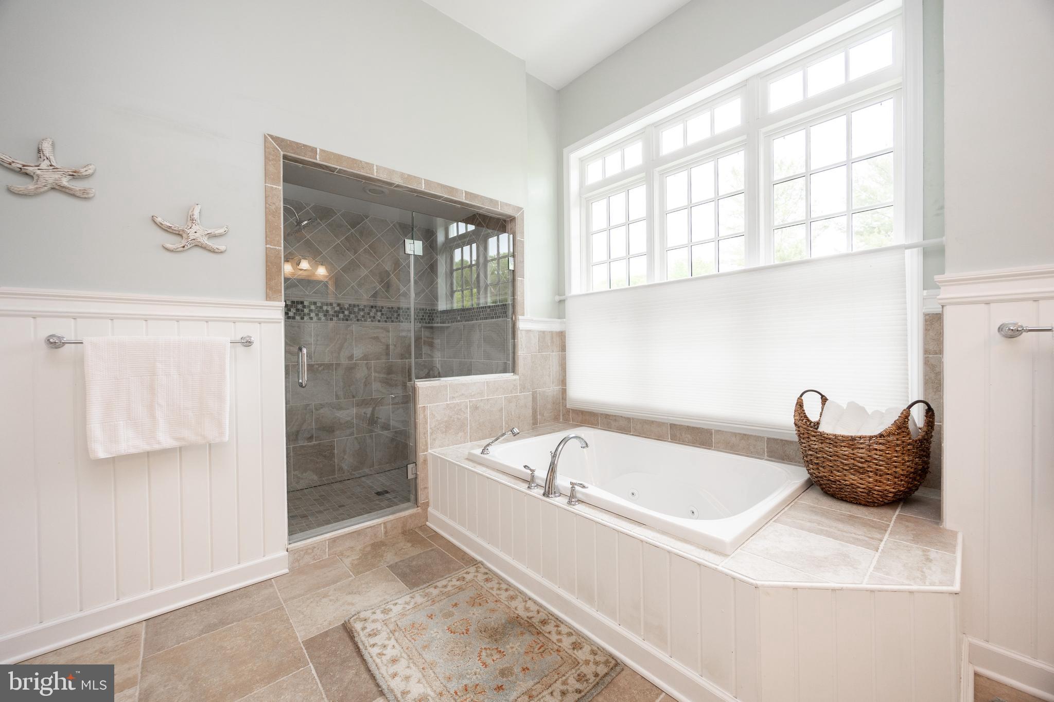 10 Brampton Road Malvern, PA 19355 - Photo 29 of 49 a bathroom with a tub and large window