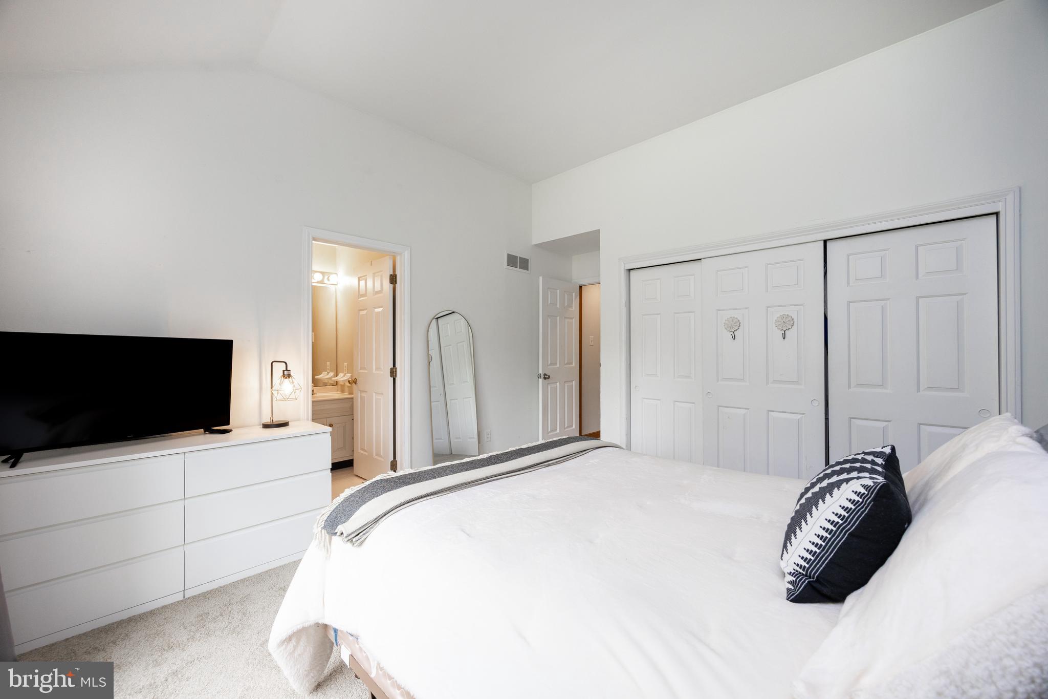 10 Brampton Road Malvern, PA 19355 - Photo 31 of 49 a bedroom with a bed and a flat screen tv