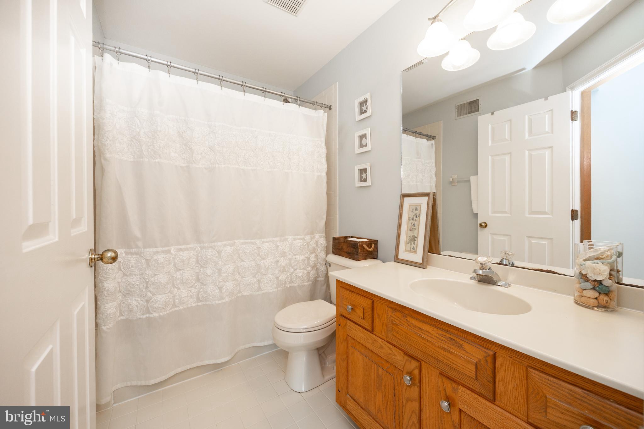 10 Brampton Road Malvern, PA 19355 - Photo 35 of 49 a bathroom with a sink a toilet and shower