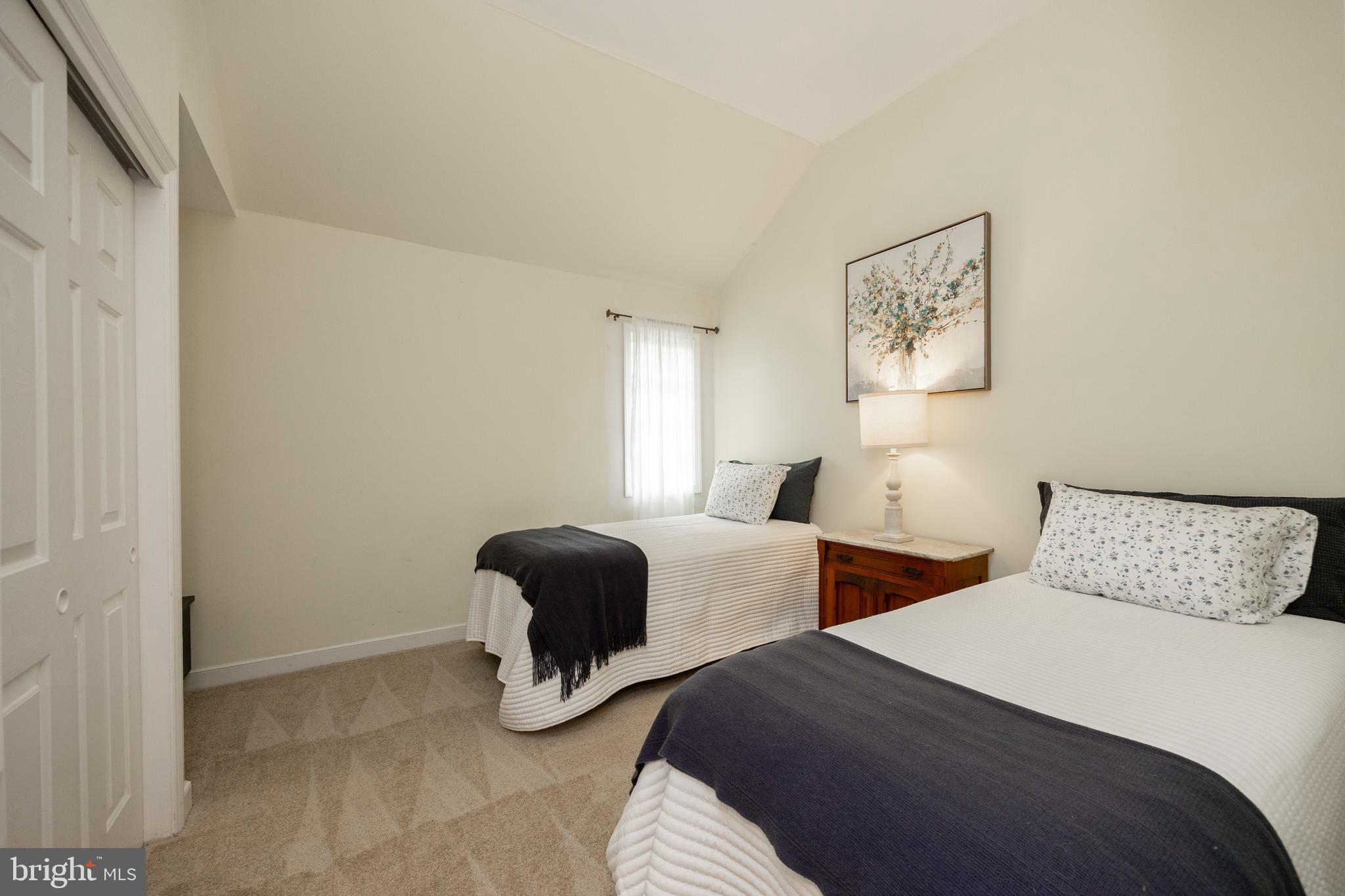 10 Brampton Road Malvern, PA 19355 - Photo 36 of 49 a bedroom with two beds and painting on the wall